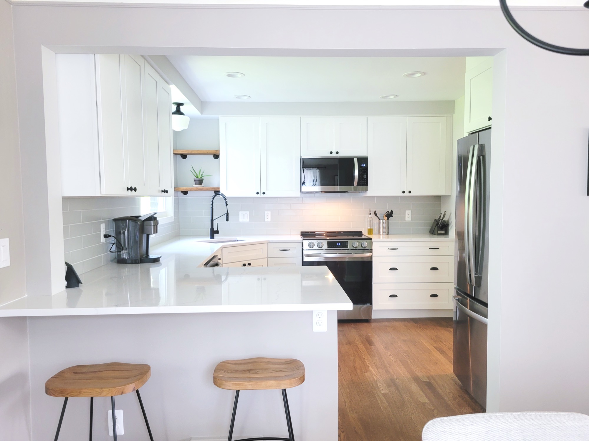 Open finished living space with island seating