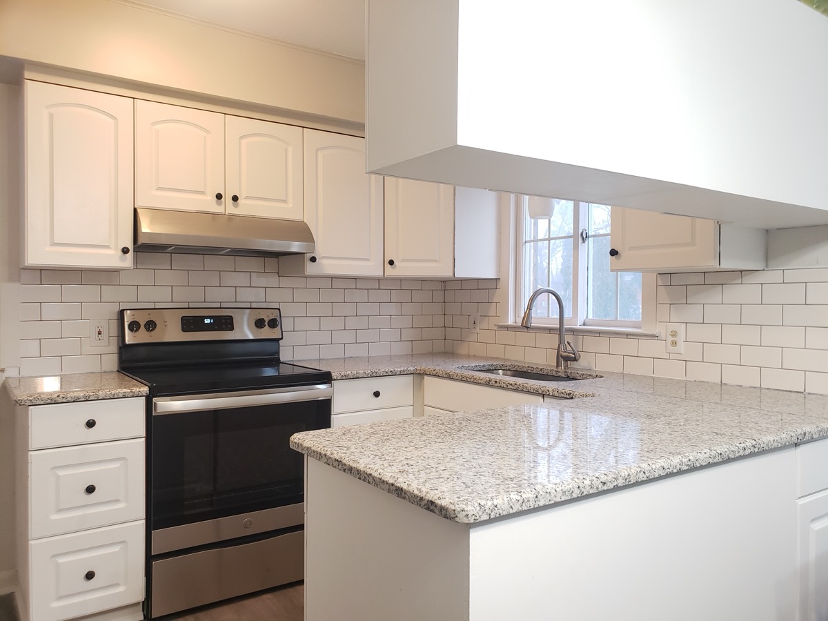 Kitchen refresh with granite counters and subway tile