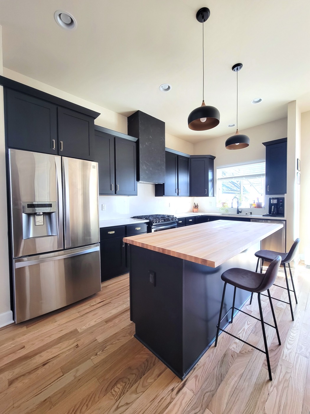 Navy kitchen remodel with butcher block island